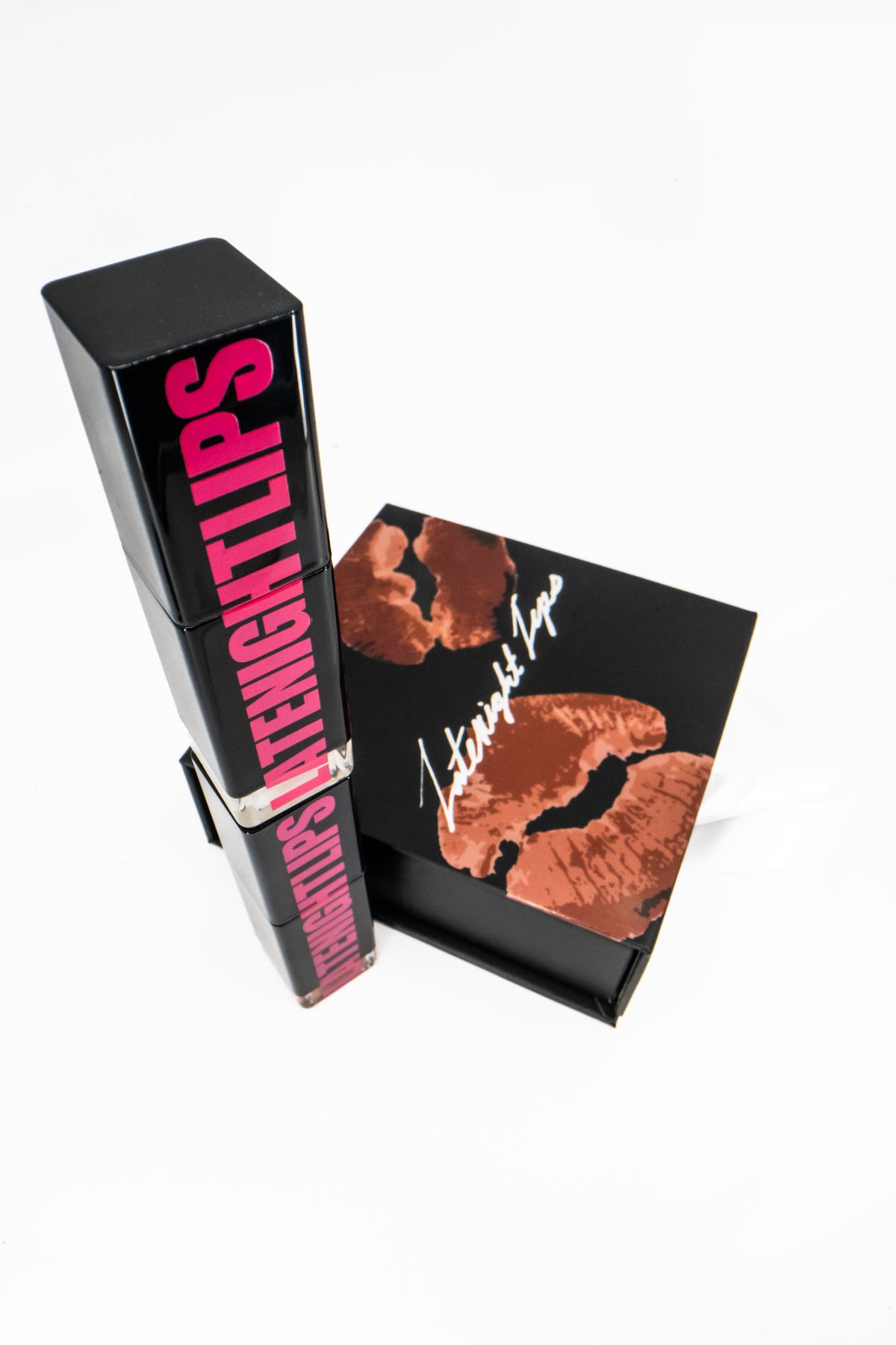 Butter'd Up and Green & Jaded glosses stacked beside the kiss-print box.