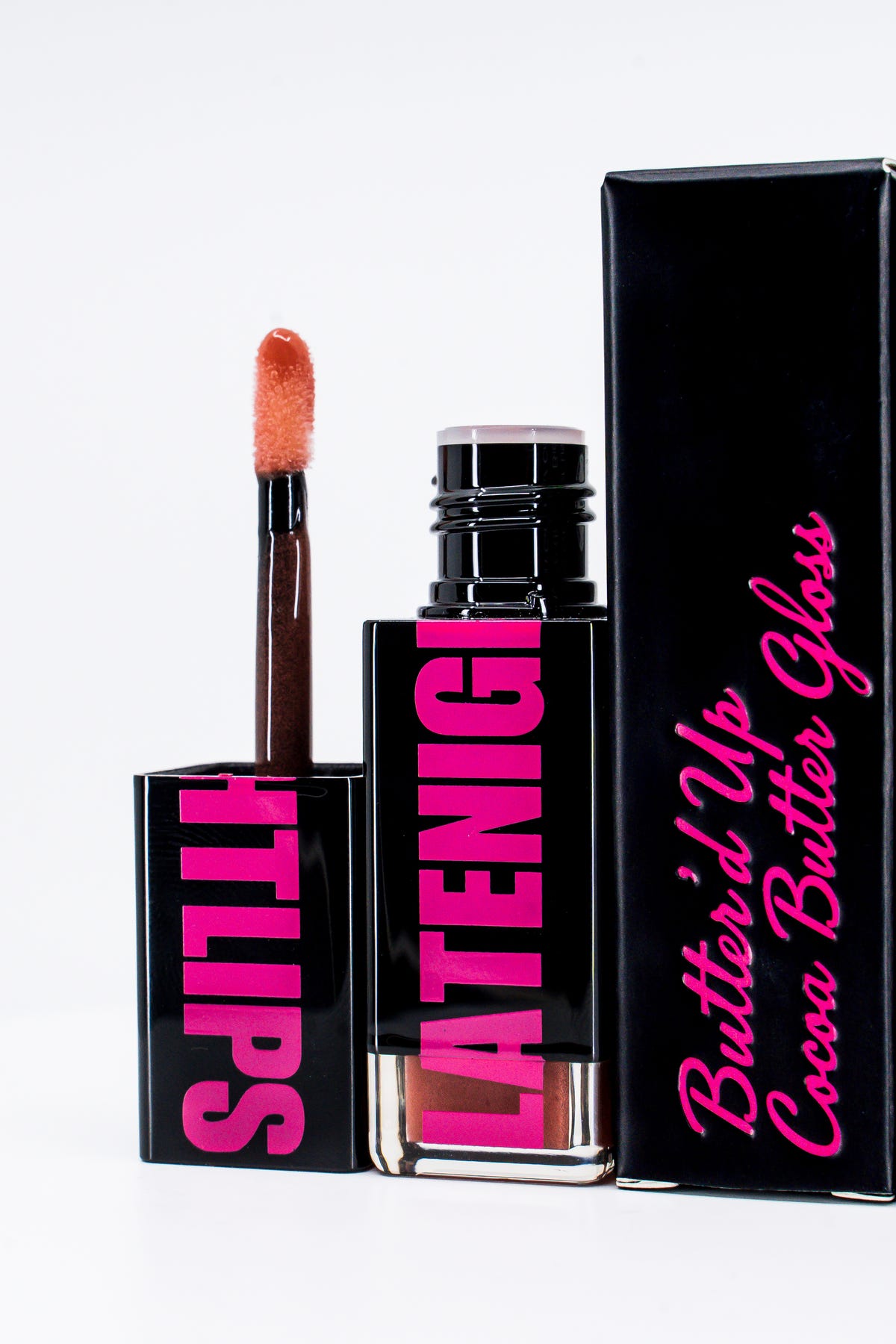 Butter'd Up gloss tube, doe-foot applicator and black carton.