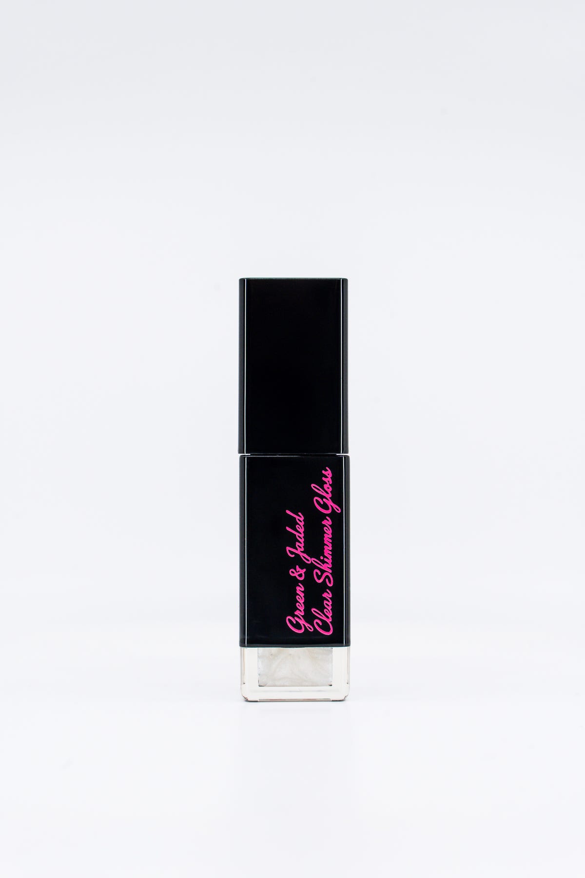 Green & Jaded clear shimmer gloss closed tube.